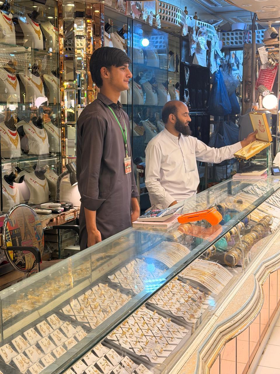 Shakeel Saraf at the gold display counter of his jewellery showroom in Mansehra, serving customers from Abbottabad and the Hazara region